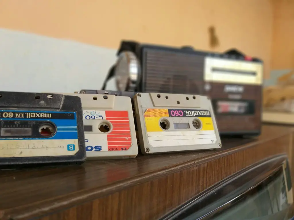 cassette tapes on brown wooden surface